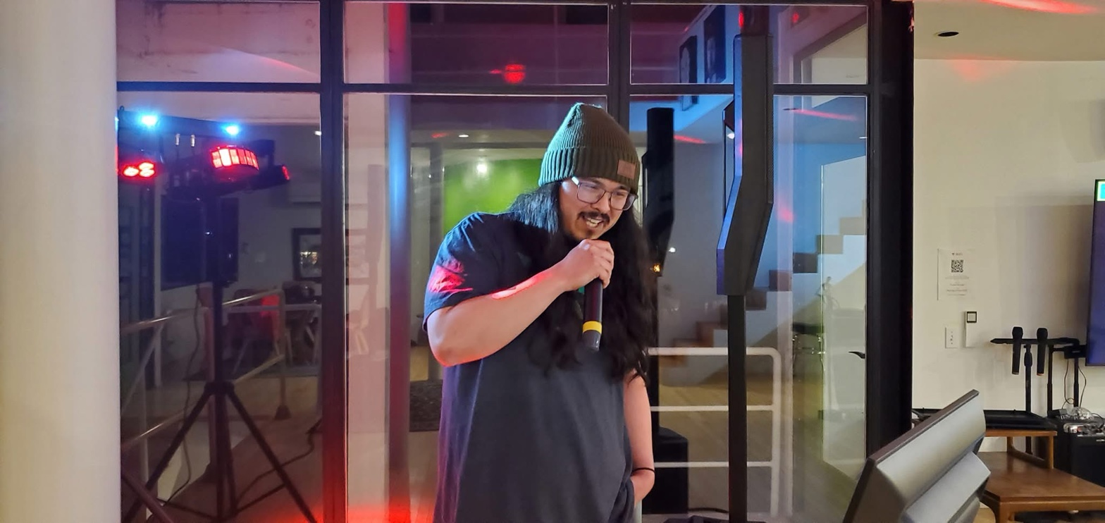 Guest performing live karaoke with CyberSound setup